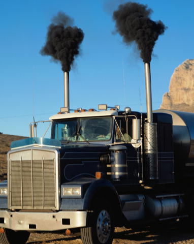 heavy truck exhausting black smoke